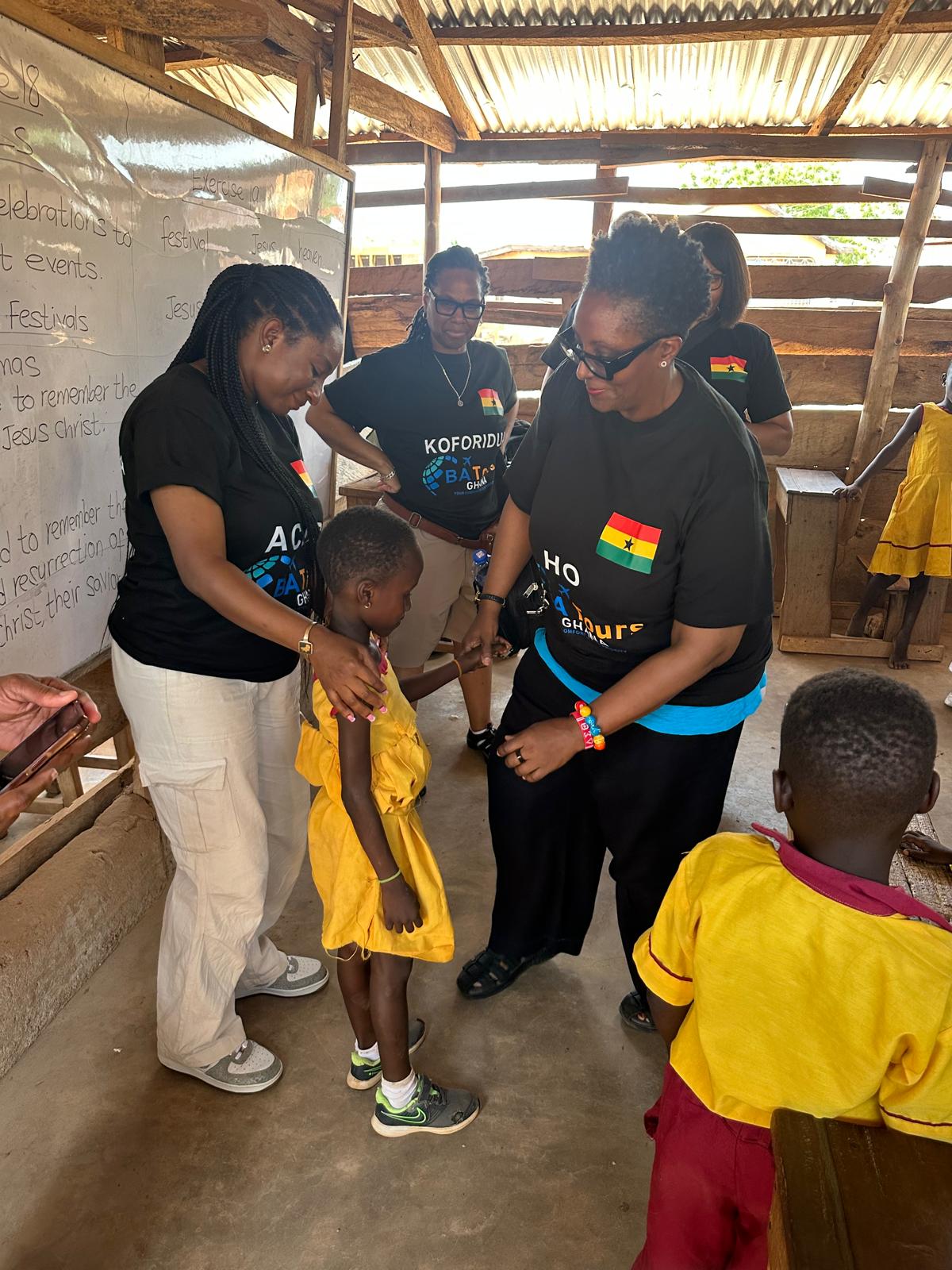 Dr Cooper with children Ghana